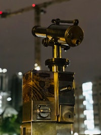 a telescope on top of a building at night